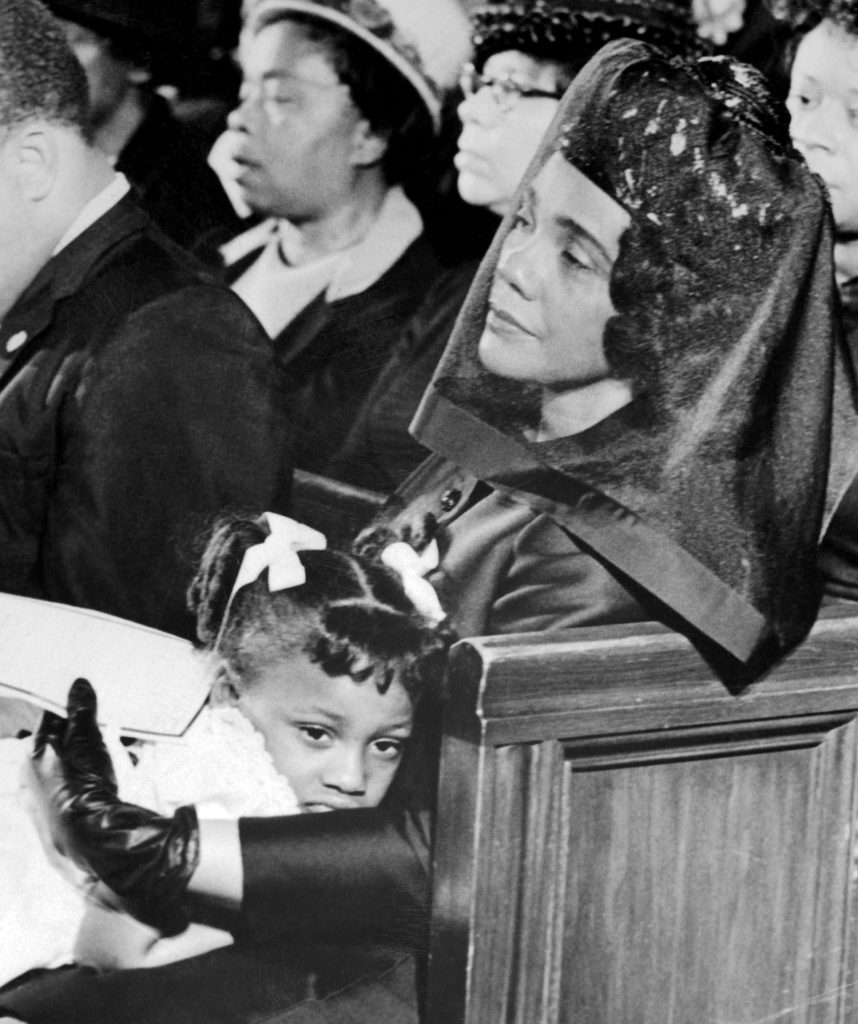 April 4 - Coretta Scott King and a young Bernice King at the funeral of Rev. Martin Luther King, Jr.