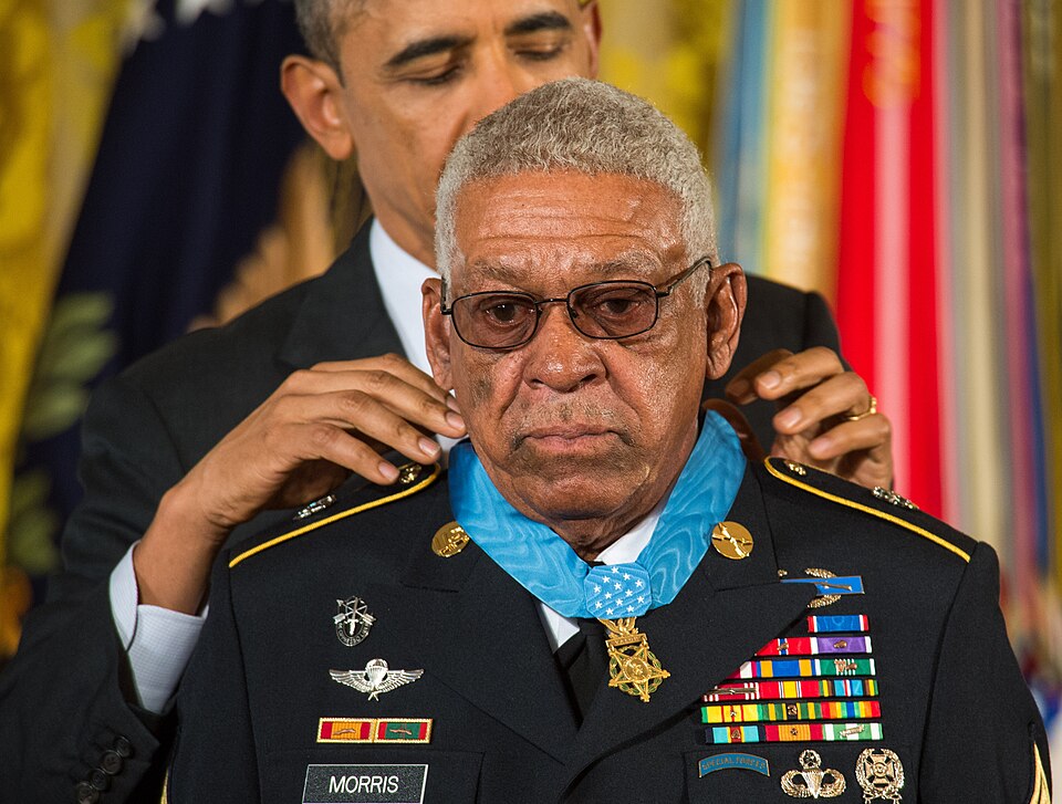 Black History Today - President Barack H. Obama, background, presents a Medal of Honor to former U.S. Army Sgt. 1st Class Melvin Morris