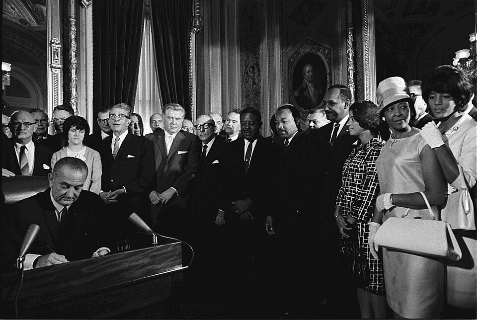 August 6 - Lyndon Johnson signing the Voting Rights Act